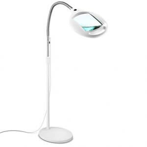 Desk lamp with magnifying glass